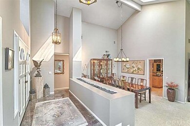 Another view of entry and formal dining room leadi