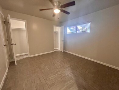 Unfurnished bedroom with multiple closets and a c