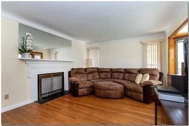 Spacious Living Room with Hardwood Floors and Bay 