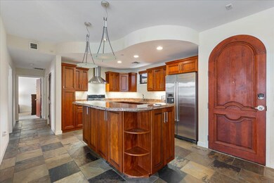Kitchen with high end fridge, wall chimney exhaus