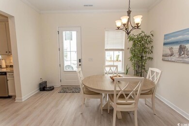 Dining room featuring baseboards, visible vents, l