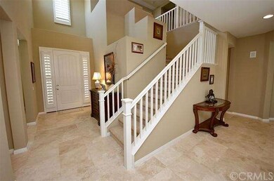 Inviting high ceiling foyer