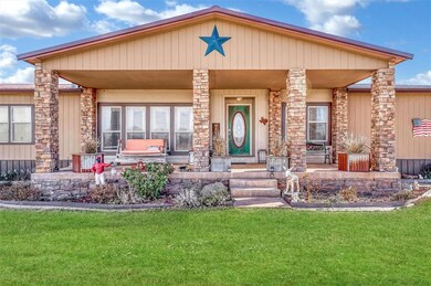 View of front of property featuring a front lawn a