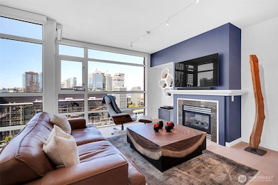 Floor to ceiling windows with remote control semi-transparent blinds.