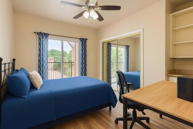 Bedroom with access to outside, multiple windows,