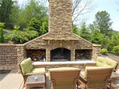 Exterior Back. Natural stone fireplace is a great 