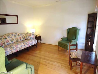 Living Room - Crown molding and refinished oak flo