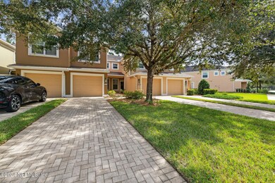 Exterior Front w/long Paver Driveway