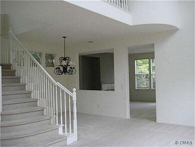 Living room with two story ceiling, looking into d