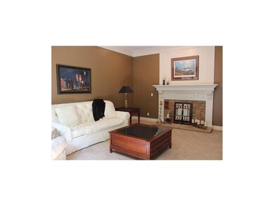 Formal living room w/stone faux fireplace, new car