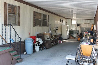 Large carport for all of your things, including sh