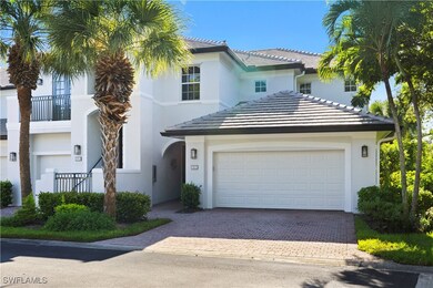 View of front of house featuring stucco siding, driveway, a tiled roof, and a garage