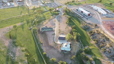 Aerial view of property's location with a golf club