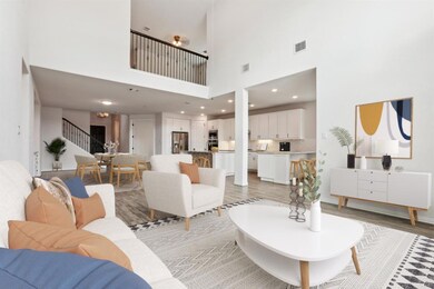 Living area featuring stairs, light wood-type flo