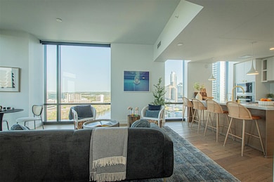 Living room featuring expansive windows and wood 