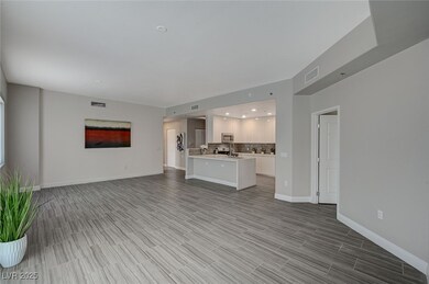 Unfurnished living room featuring light wood-style