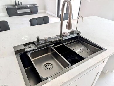 Details featuring stone counters, baseboards, and 