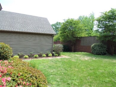Angle view of backyard, not too large but not too 