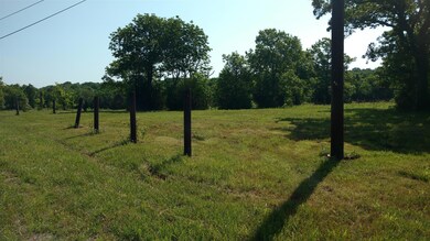 At the Far South Corner along the front Road Frontage side