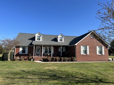 Great landscaping and concrete sidewalk to the front door.