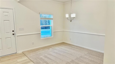 Unfurnished dining area with crown molding, a chandelier, and light wood-type flooring