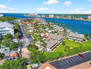Bird's eye view of a large body of water and apartment complex / building