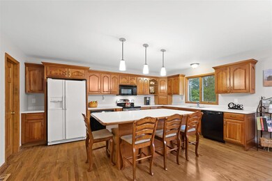 The kitchen includes a big breakfast bar island an