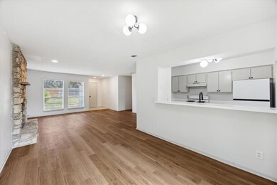Unfurnished living room with wood finished floors