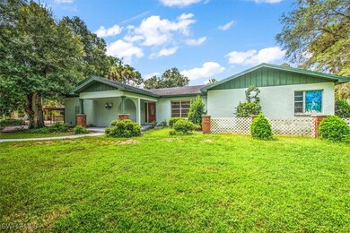 Single story home with a front yard