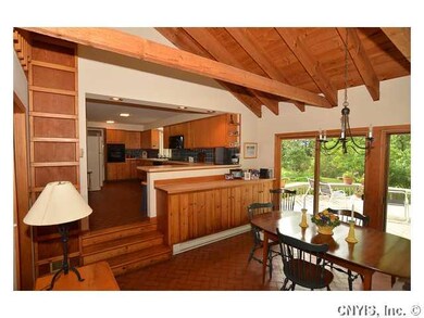 Kitchen. Exposed beams and vaulted ceilings make t