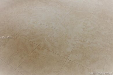 Porcelain tile floor throughout living area