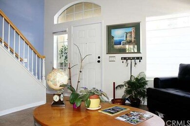 Entry way / living room.  Sports tall cathedral ce