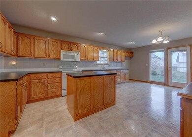 1102 Camelot Dr, Raymore, MO 64083 - photo 2