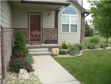 ENTRANCE TO HOME, CHECK OUT THE PRETTY LANDSCAPING