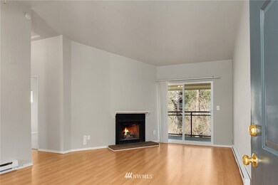 Welcome home to your light and bright condo, cozy fireplace and deck with peaceful views.