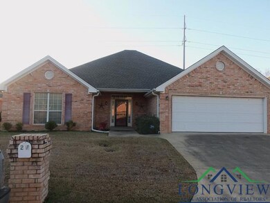 View of front of property featuring a front lawn a