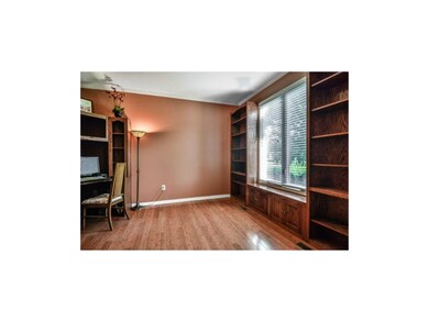 To your right is the main level office with hardwo