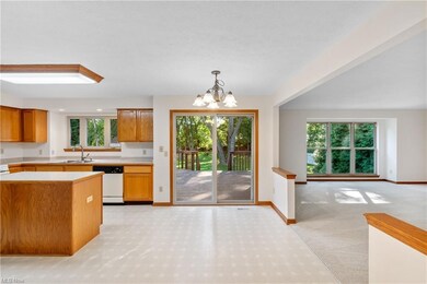 Kitchen featuring white dishwasher, light countert
