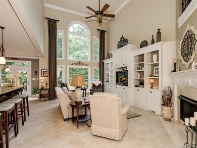 Great Room, Fireplace, Kitchen looking out over the golf course