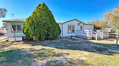 View of front of house with a front yard and a deck