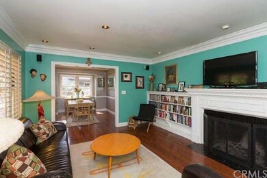 Large Living room with can lights, crown molding a