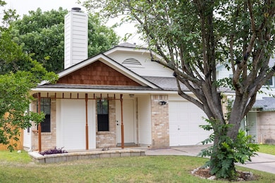 View of front facade with an attached garage, a p