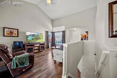 Living room with wood-type flooring, ceiling fan, 