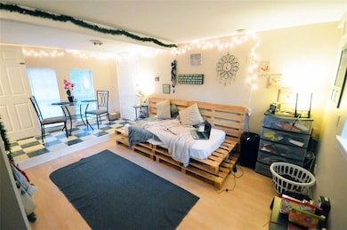 Bedroom featuring wood finished floors