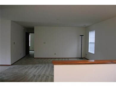 Den. Large living room/den with room for formal dining .Lots of day light windows!