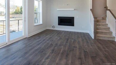 Large living room with modern fireplace and a 9 fo