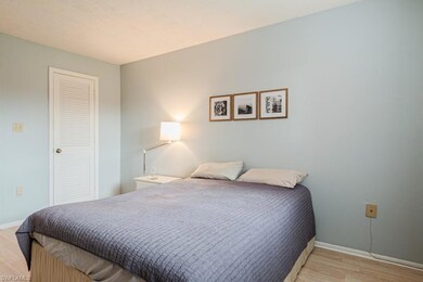 Bedroom with light hardwood / wood-style flooring 