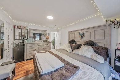 Bedroom with wood finished floors