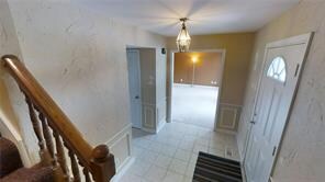 Entry:  Ceramic tile and wainscoting large Entry