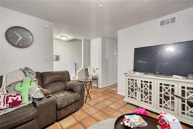 Living area with tile patterned flooring